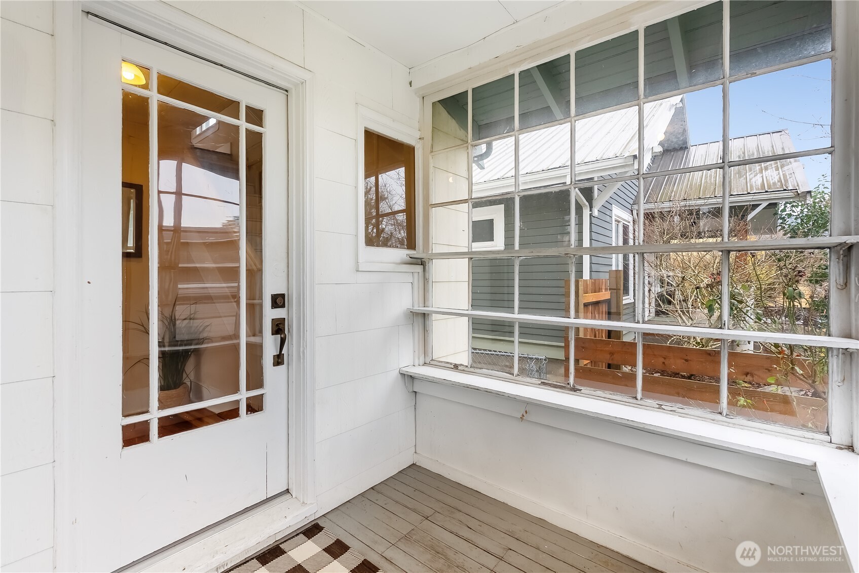 2414 Elm Street Bellingham, WA 98225 - Photo 4 of 36 a view of a balcony with wooden floor and fence