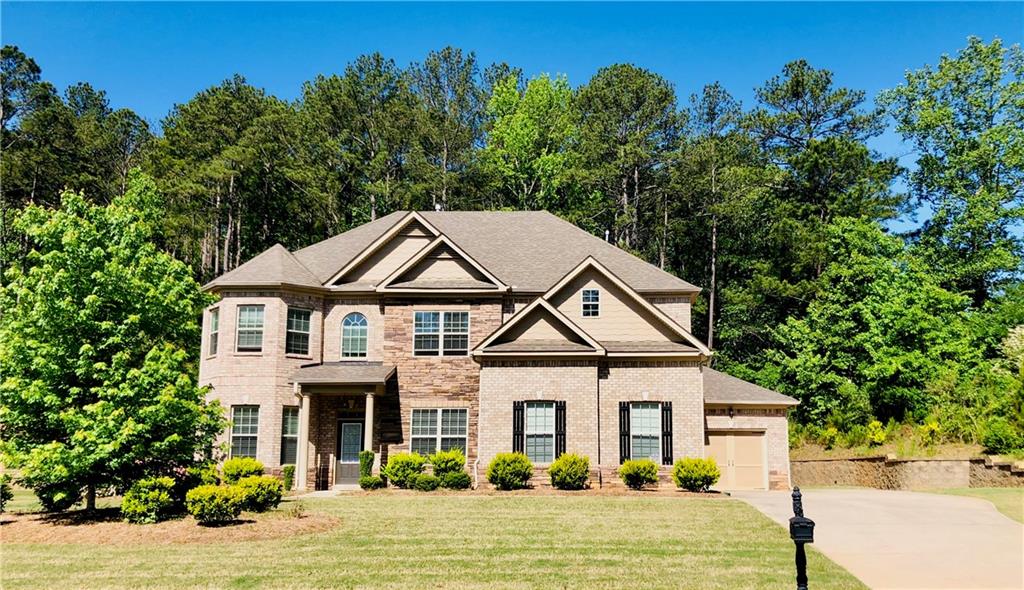 250 Shellbark Drive McDonough, GA 30252 - Photo 1 of 1 a view of a white house with a big yard and potted plants