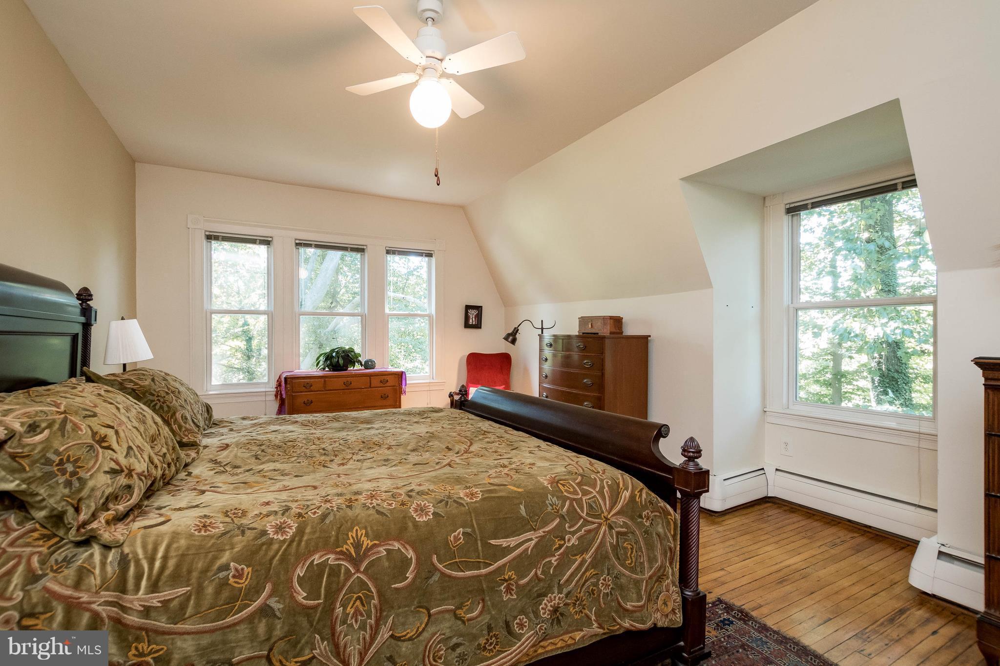 6012 Terrace Road Baltimore, MD 21209 - Photo 14 of 29 a bed sitting in a bedroom next to a window