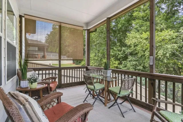 a view of a chair and table in the balcony