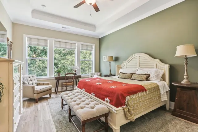 a bedroom with a bed and a couch