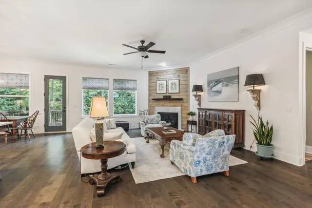 a living room with furniture fireplace and window