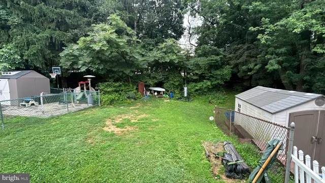 a view of a table and chairs in the garden