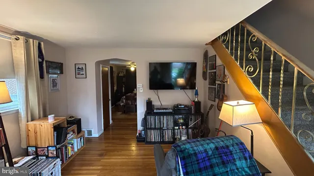 a living room with furniture and a flat screen tv