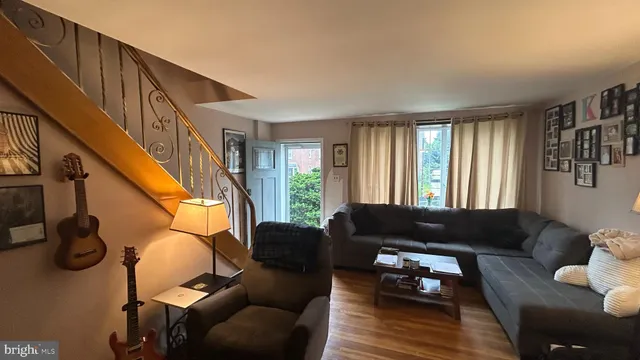 a living room with furniture or couch and a window