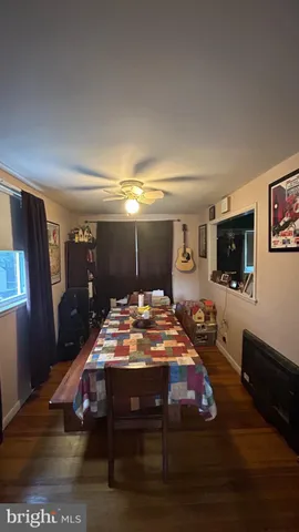 a room with furniture a flat screen tv and a table