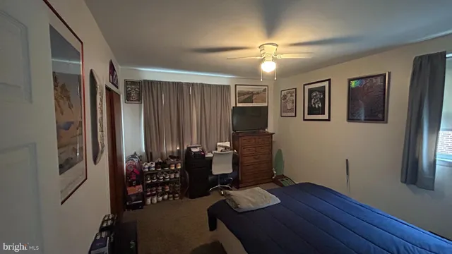 a view of a workspace with furniture and chandelier