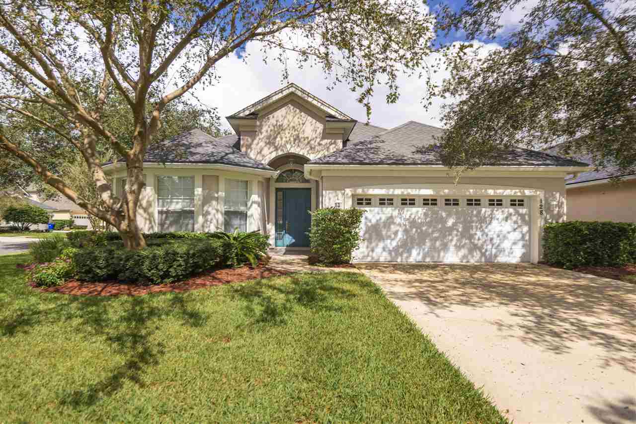 128 St Andrews Pl Drive St. Augustine, FL 32092 - Photo 2 of 38 a view of a house with a big yard and large tree