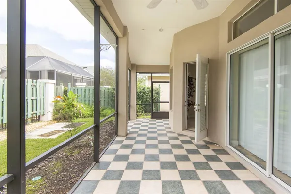 a view of a city from a glass door
