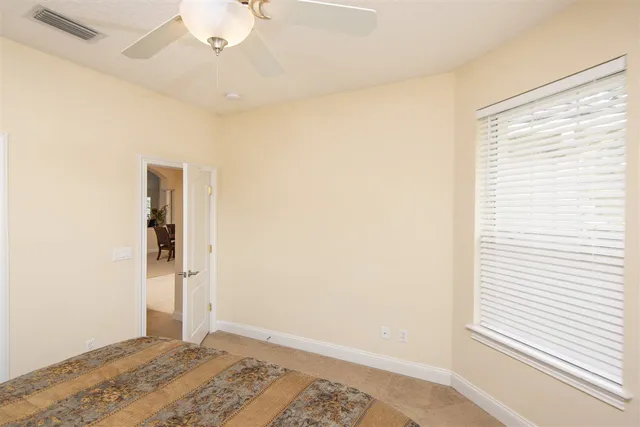 a view of room with window and wooden floor