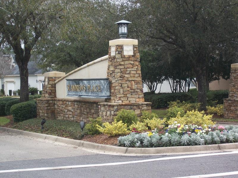 128 St Andrews Pl Drive St. Augustine, FL 32092 - Photo 37 of 38 a front view of a house with a yard and garage