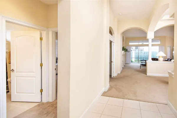 a view of a hallway with a living room
