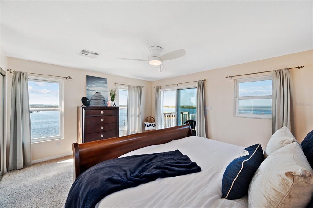 2417 Sunset Vista Drive Spring Hill, FL 34607 - Photo 13 of 61 a bedroom with a bed and wooden floor