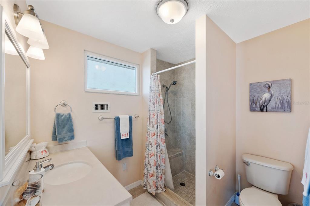 2417 Sunset Vista Drive Spring Hill, FL 34607 - Photo 14 of 61 a bathroom with a sink toilet and shower