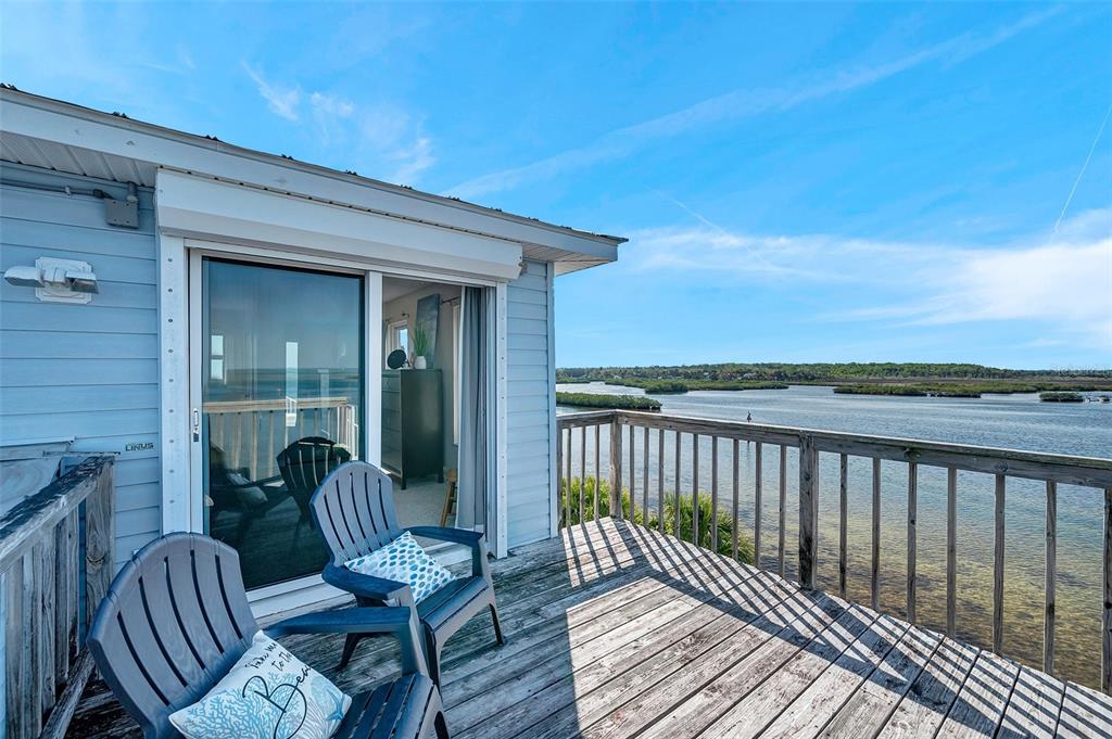 2417 Sunset Vista Drive Spring Hill, FL 34607 - Photo 16 of 61 a view of a two chairs in balcony