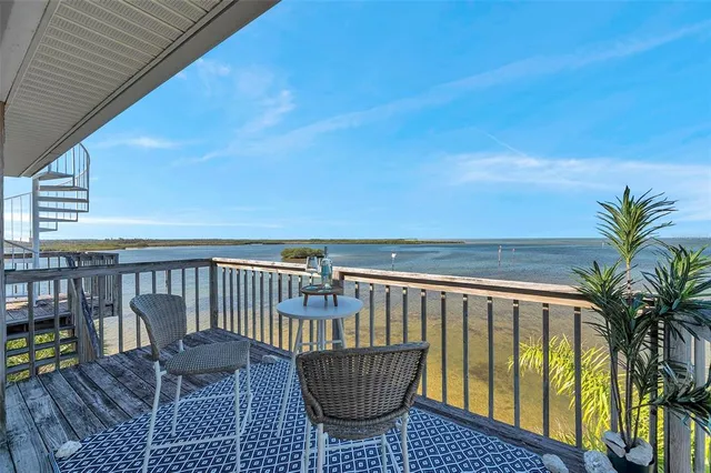 a balcony with wooden floor