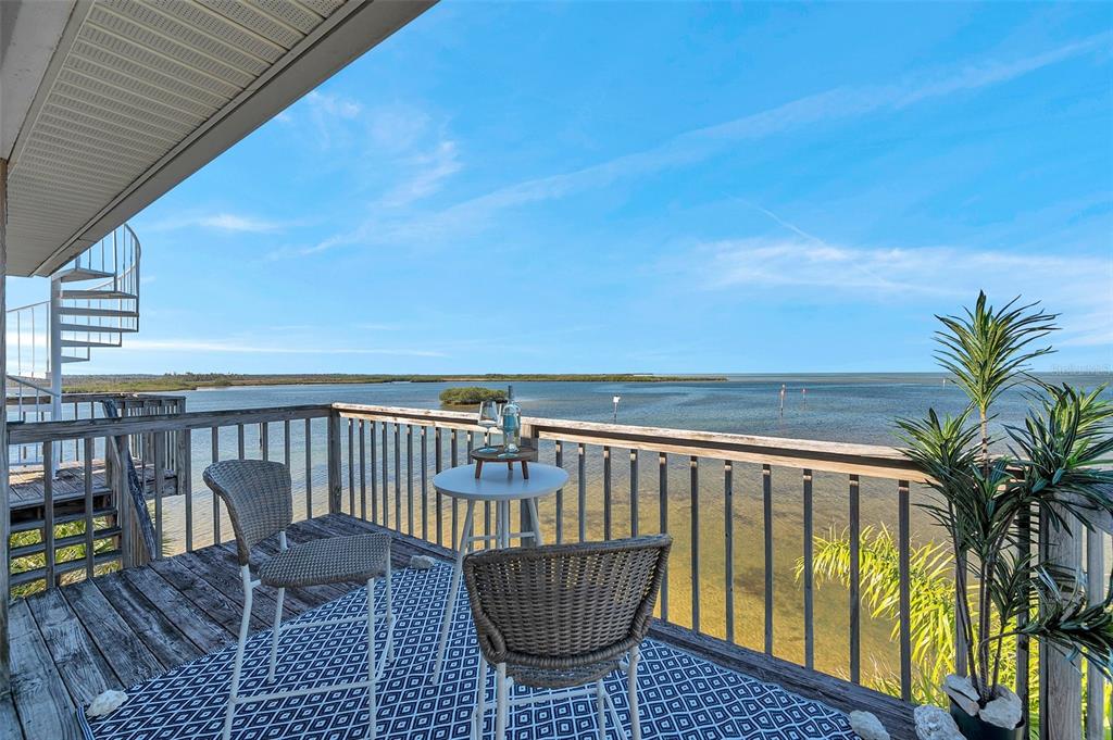 2417 Sunset Vista Drive Spring Hill, FL 34607 - Photo 22 of 61 a view of balcony with a potted plant and outdoor seating