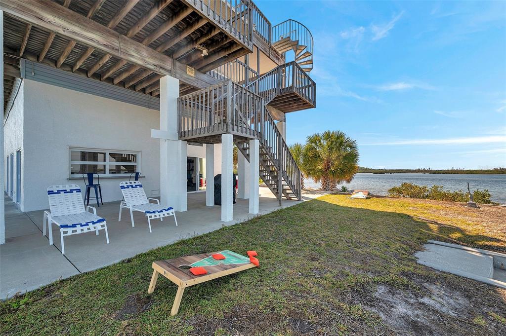 2417 Sunset Vista Drive Spring Hill, FL 34607 - Photo 36 of 61 a backyard of a house with table and chairs