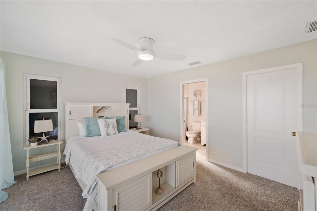 2417 Sunset Vista Drive Spring Hill, FL 34607 - Photo 40 of 61 a spacious bedroom with a bed and a cabinets