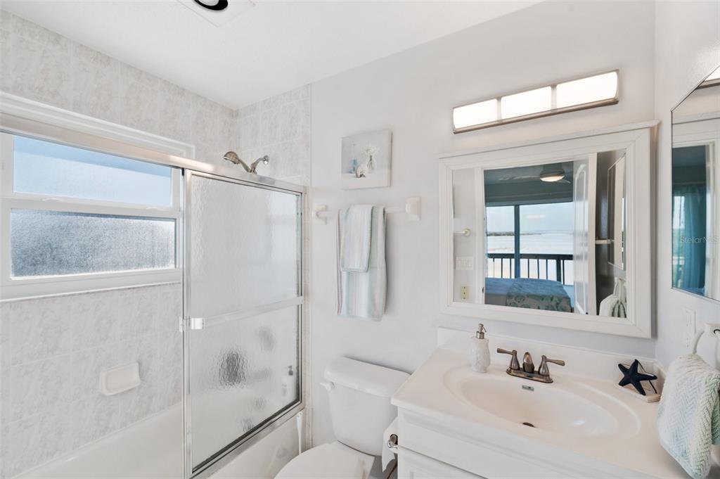 2417 Sunset Vista Drive Spring Hill, FL 34607 - Photo 41 of 61 a bathroom with a bathtub shower sink vanity and toilet