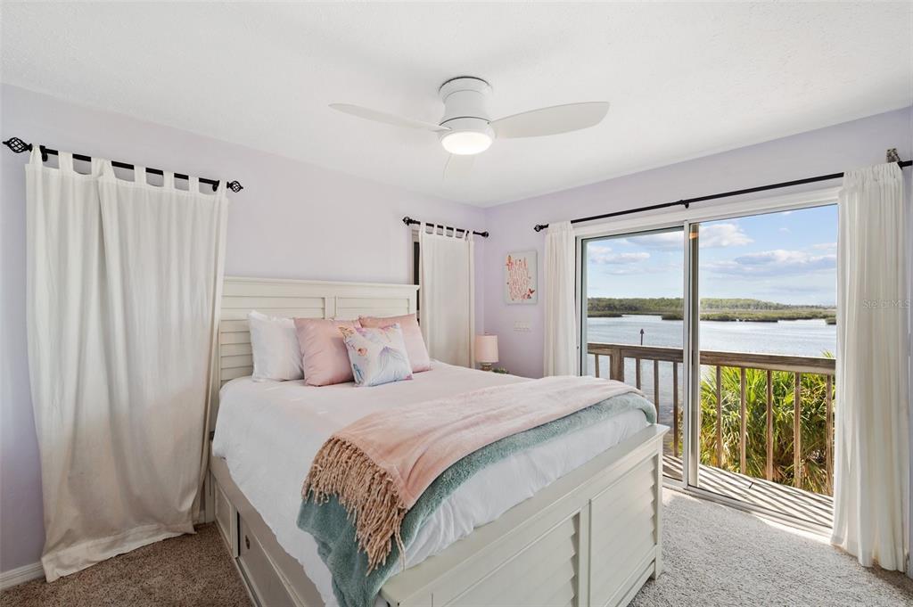 2417 Sunset Vista Drive Spring Hill, FL 34607 - Photo 42 of 61 a bedroom with a large bed and a large window