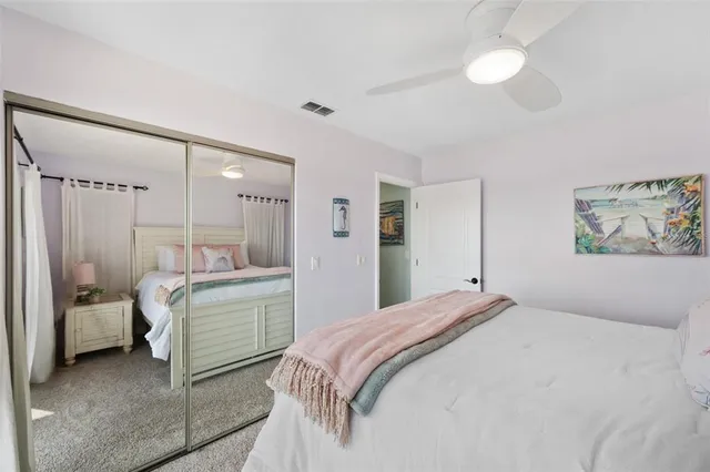 a view of a balcony with wooden floor and outdoor seating