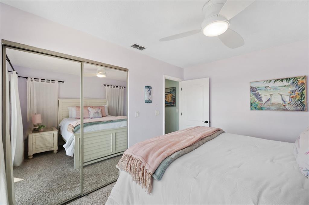 2417 Sunset Vista Drive Spring Hill, FL 34607 - Photo 43 of 61 a bedroom with a bed and a walk in closet