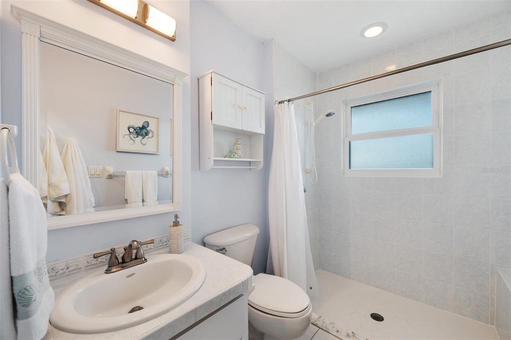 2417 Sunset Vista Drive Spring Hill, FL 34607 - Photo 44 of 61 a bathroom with a sink toilet and shower