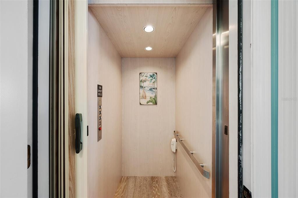 2417 Sunset Vista Drive Spring Hill, FL 34607 - Photo 45 of 61 a view of a hallway with a elevator