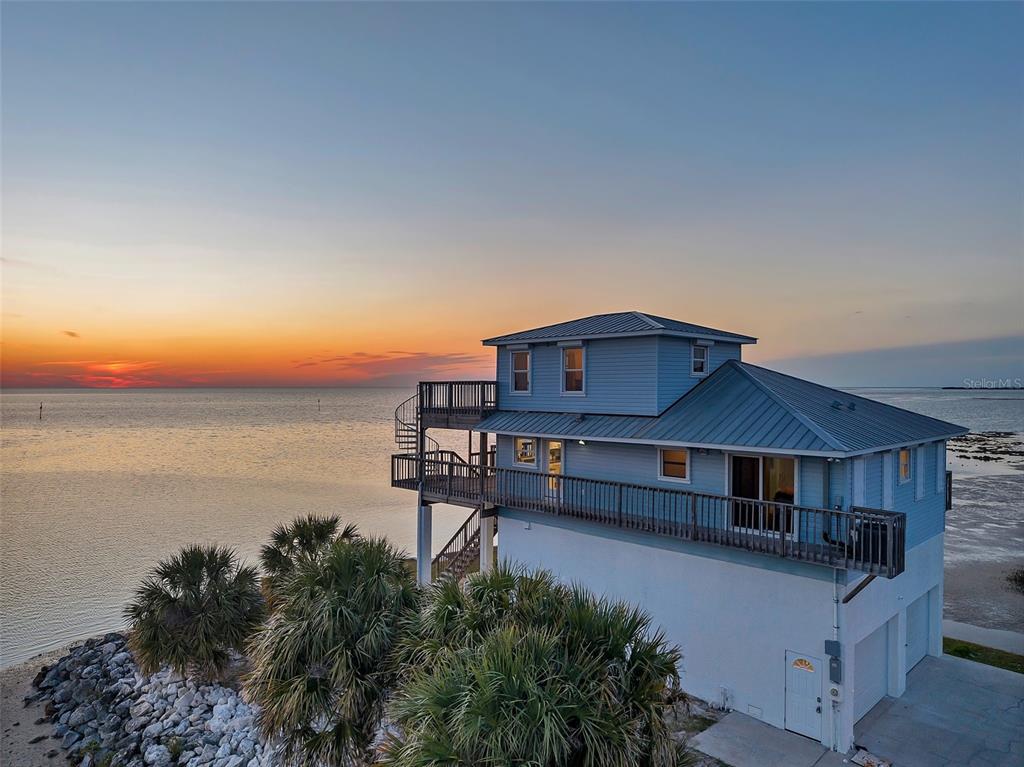 2417 Sunset Vista Drive Spring Hill, FL 34607 - Photo 50 of 61 a house view with a seating space and garden view