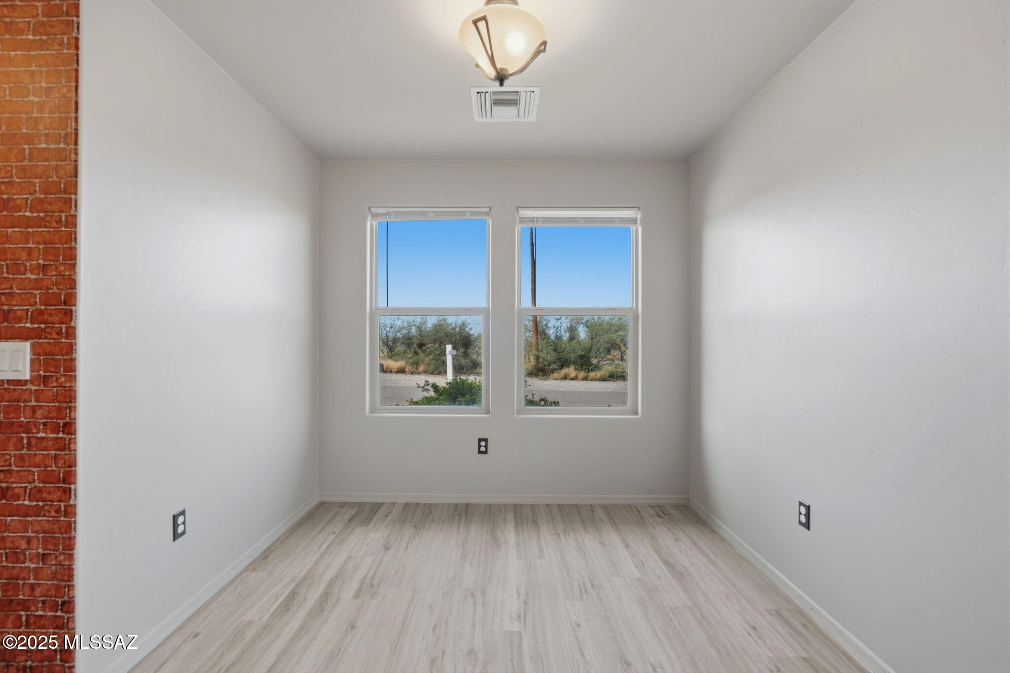 1458 North Wentworth Road Vail, AZ 85641 - Photo 11 of 44 an empty room with a window