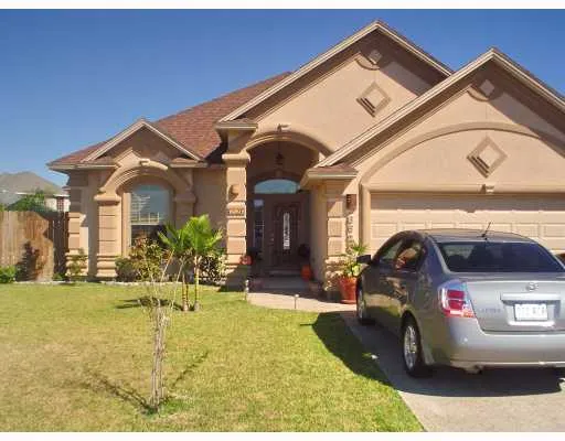 a view of a car park in front of house