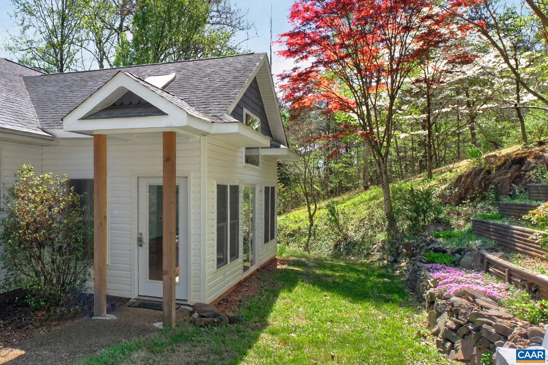 689 Mutton Hollow Road Stanardsville, VA 22973 - Photo 13 of 61 a view of a house with a yard and potted plants