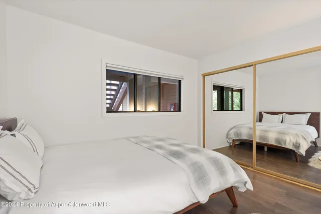 a bathroom with a sink toilet vanity and shower