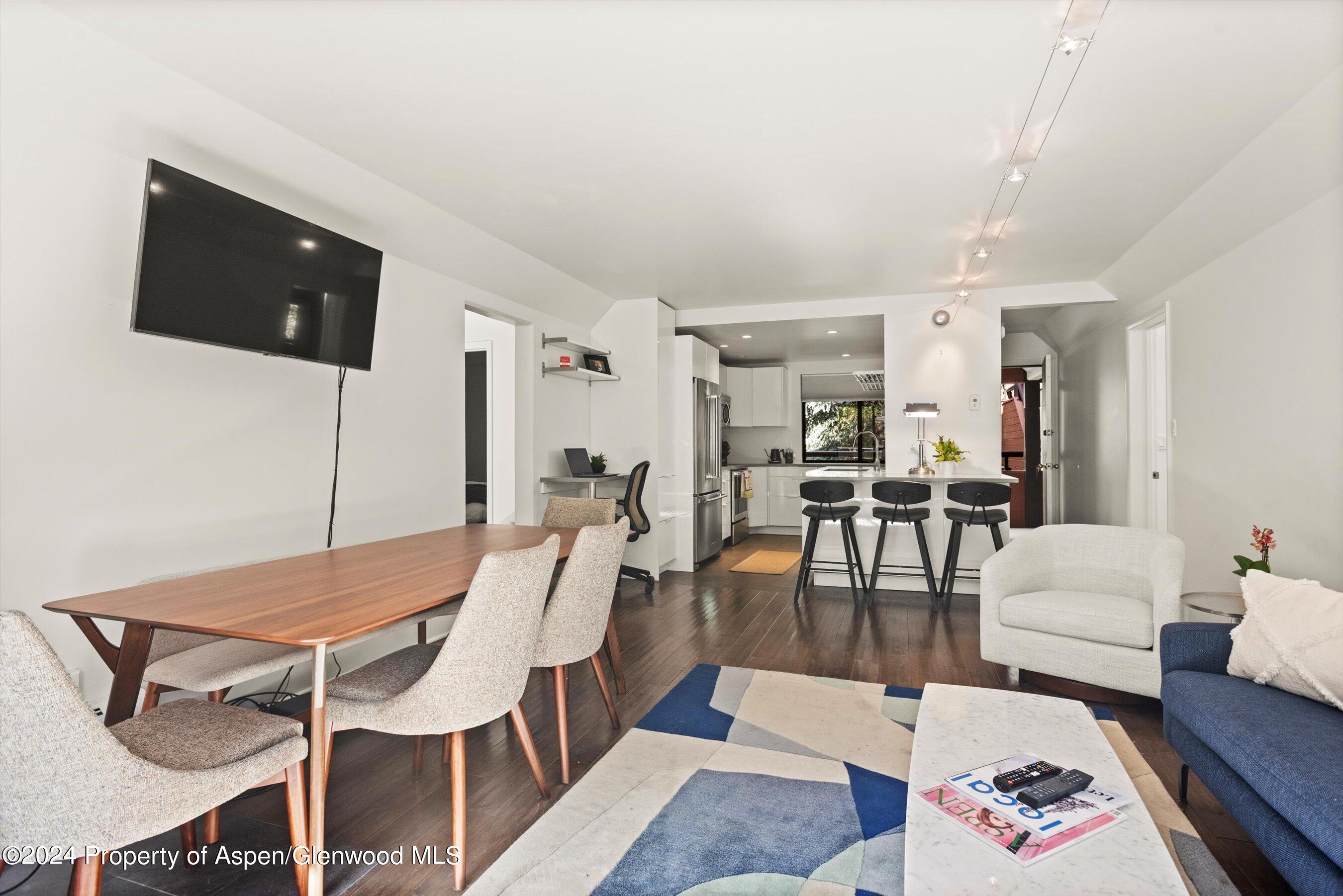 1326 Vine Street, Unit 1326 Aspen, CO 81611 - Photo 4 of 16 a living room with furniture and wooden floor