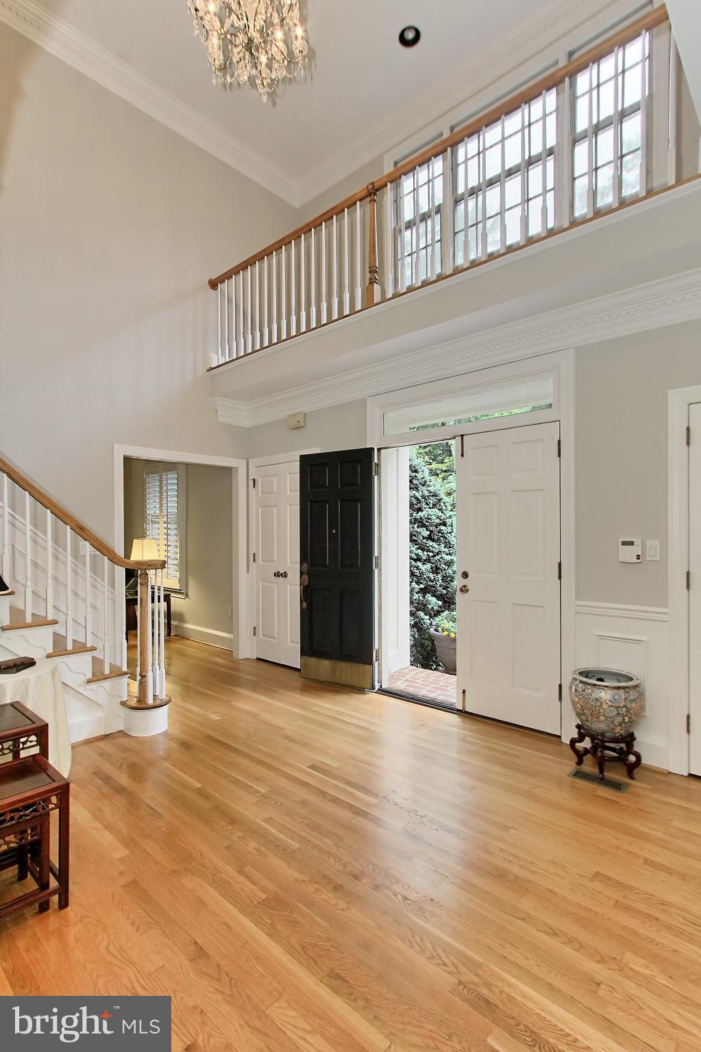 Two Story Foyer with Crystal Chandelier
