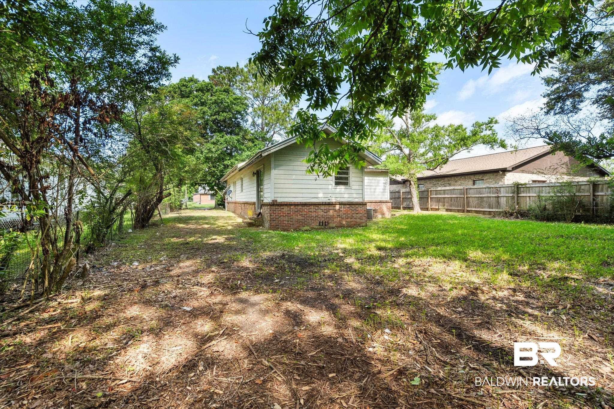 672 Burden Street Mobile, AL 36607 - Photo 18 of 20 View of yard featuring fence