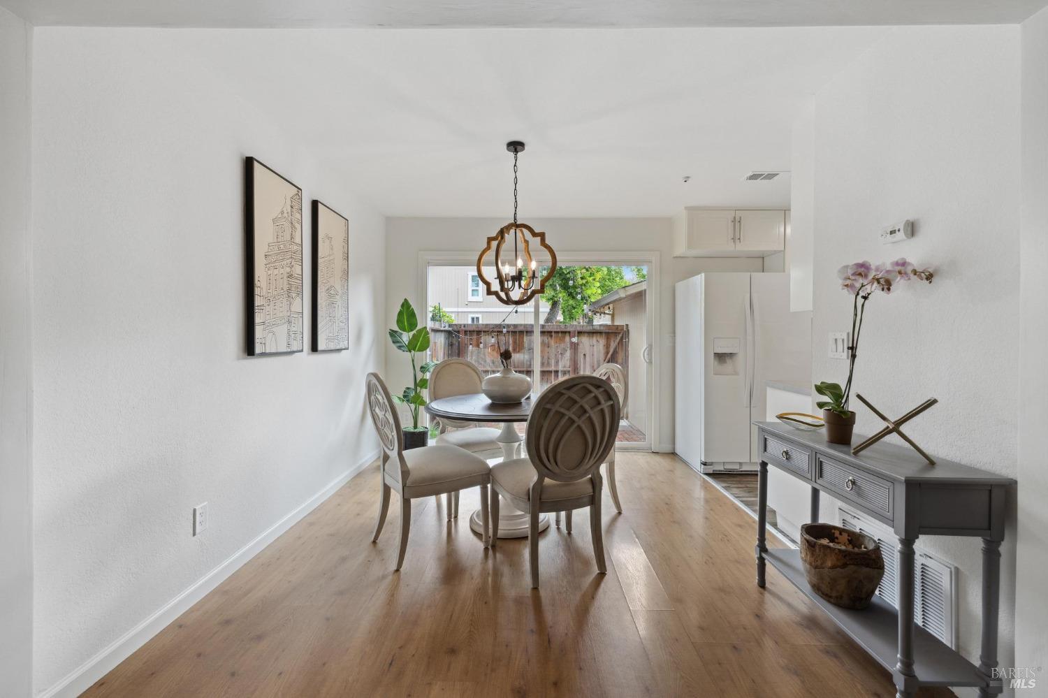 1426 Gold Way Rohnert Park, CA 94928 - Photo 6 of 42 a view of a dining room with furniture wooden floor and a chandelier