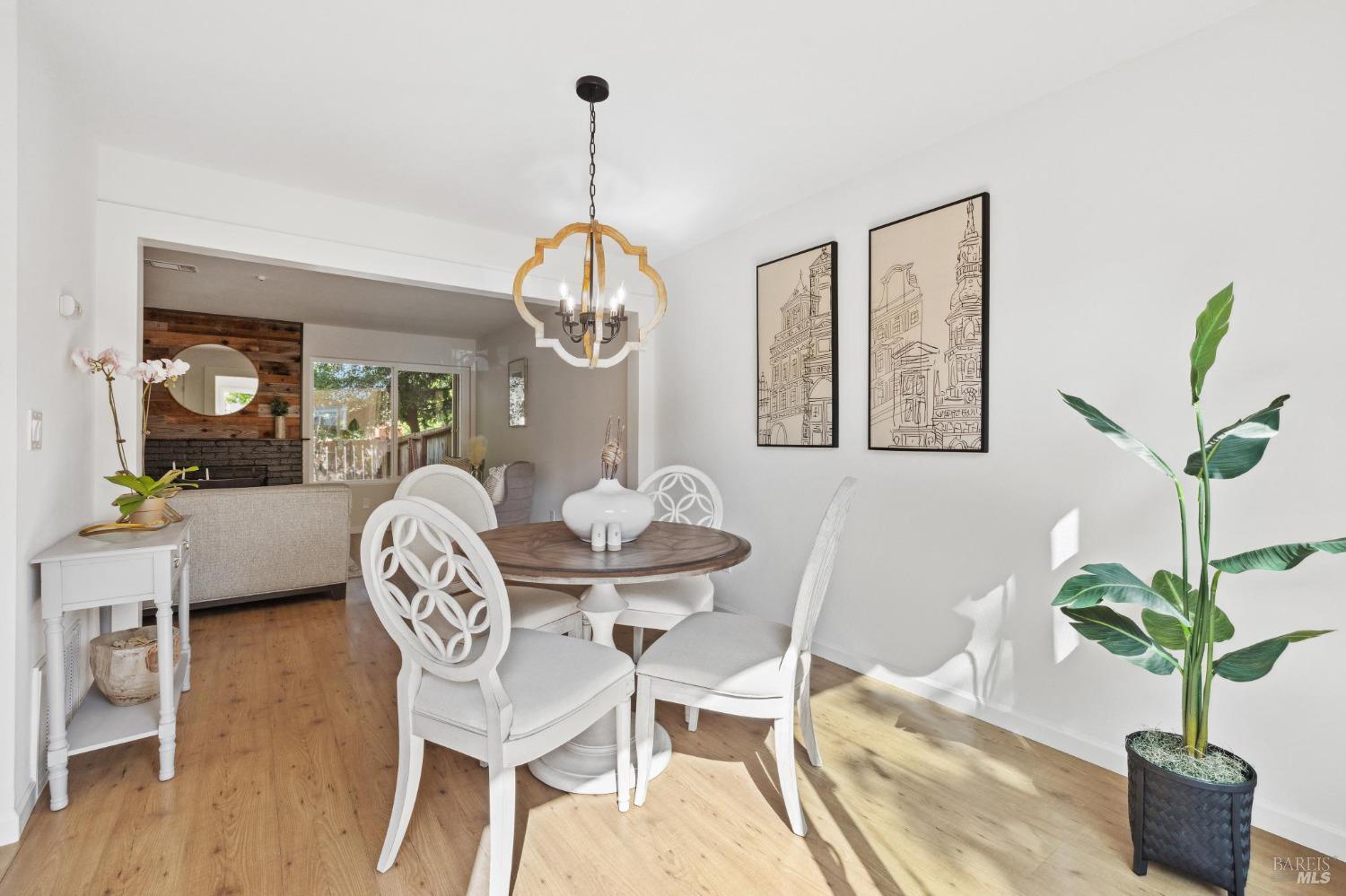 1426 Gold Way Rohnert Park, CA 94928 - Photo 9 of 42 a view of a dining room with furniture wooden floor and chandelier