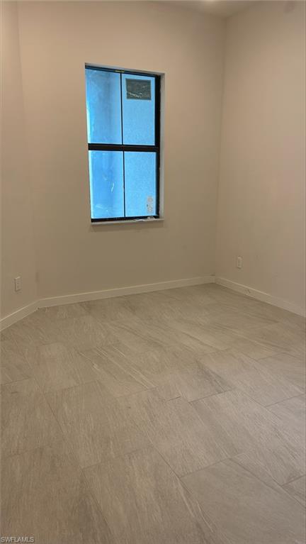 14557 Kingfisher Loop Naples, FL 34120 - Photo 15 of 27 a view of an empty room