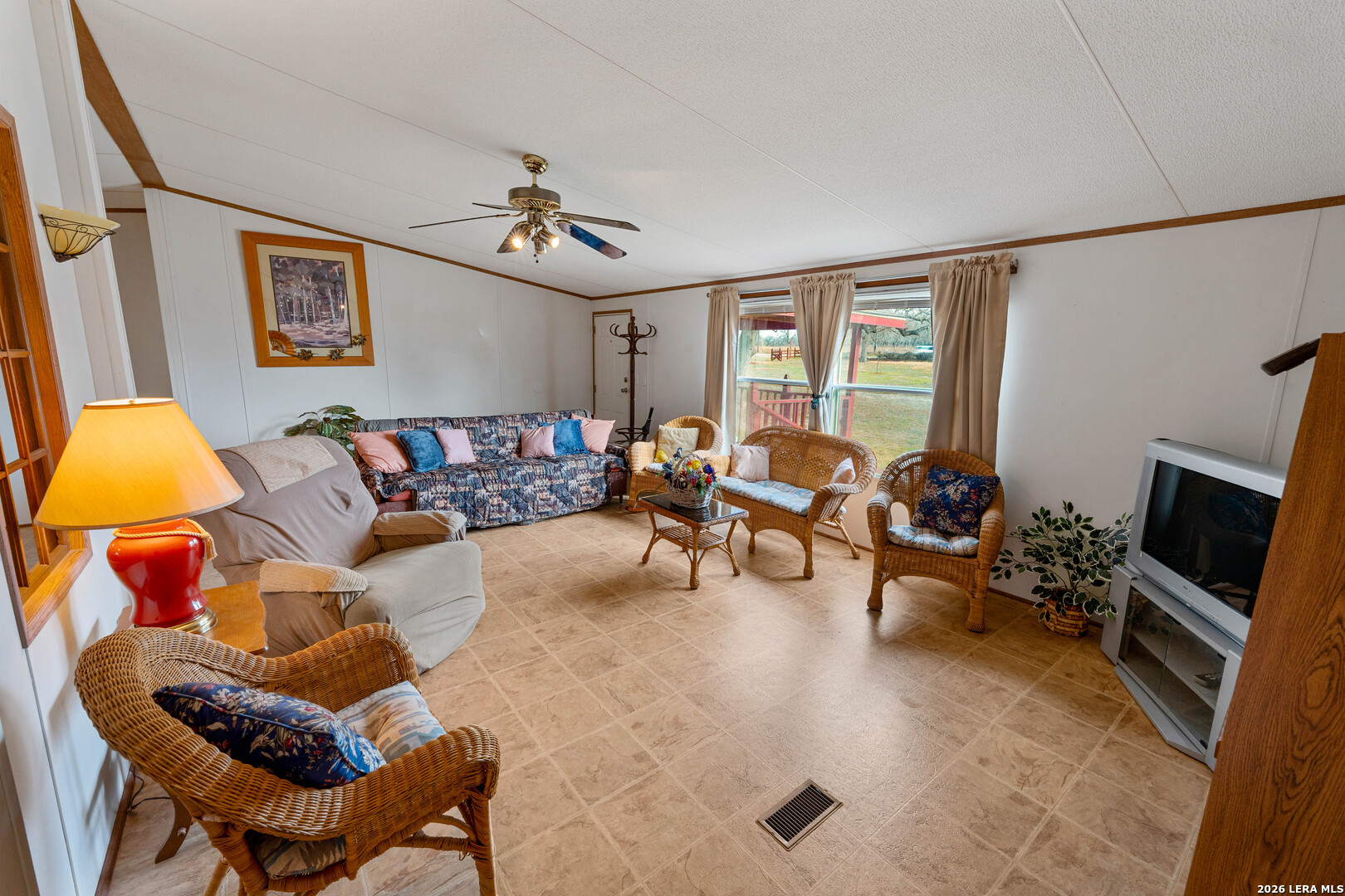 104 Longhorn Road Stockdale, TX 78160 - Photo 9 of 47 a living room with furniture and a flat screen tv
