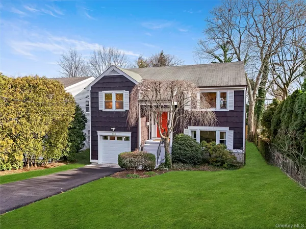 front view of a house with a yard