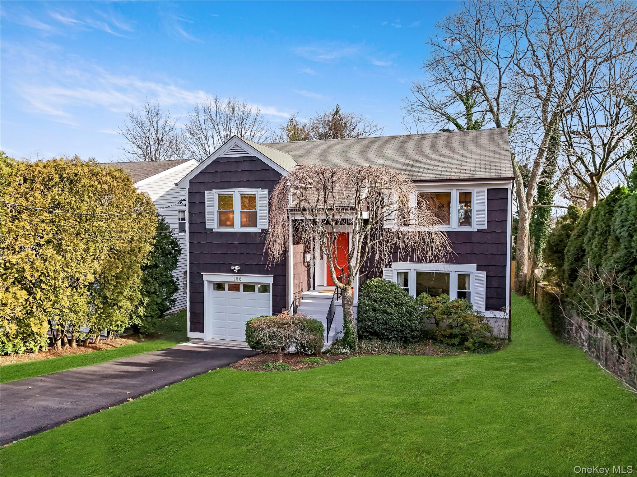 166 Highview Street Mamaroneck, NY 10543 - Photo 1 of 30 front view of a house with a yard