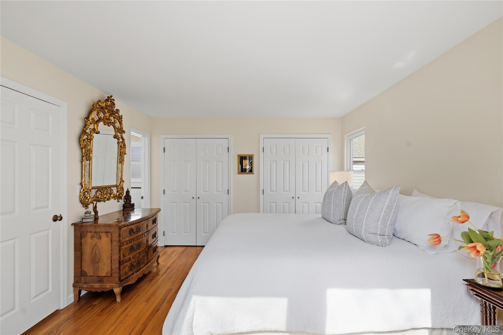 166 Highview Street Mamaroneck, NY 10543 - Photo 13 of 30 a bedroom with a bed and wooden floor