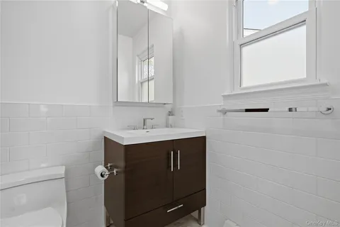 a bathroom with a sink and mirror