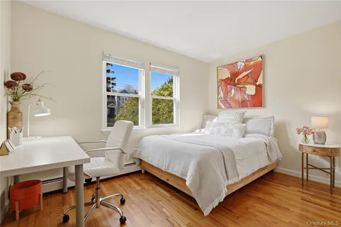a bedroom with a bed and a table