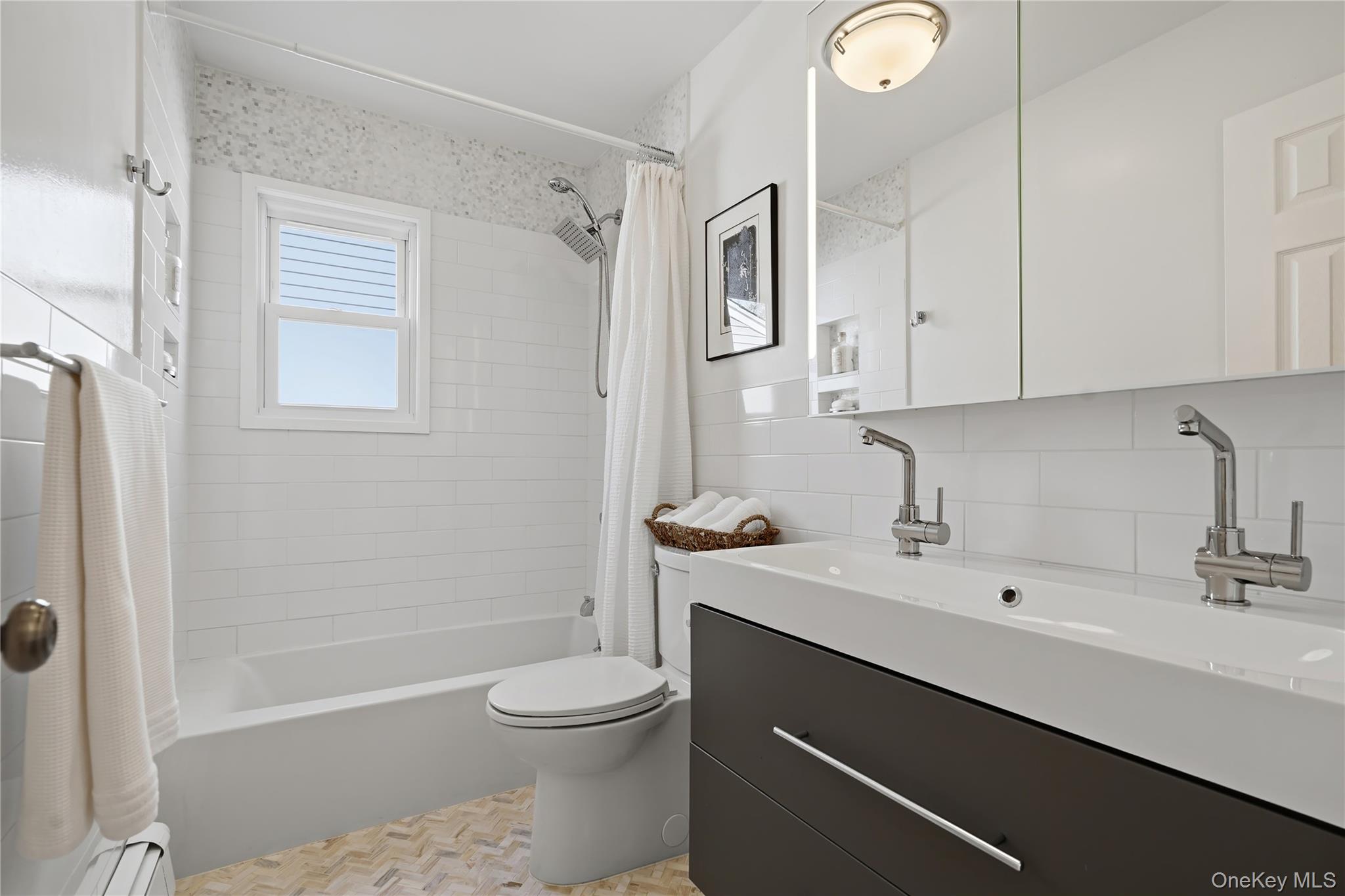 166 Highview Street Mamaroneck, NY 10543 - Photo 18 of 30 a bathroom with a sink a toilet and shower