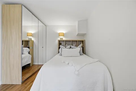 a bedroom with a bed and a view of bathroom