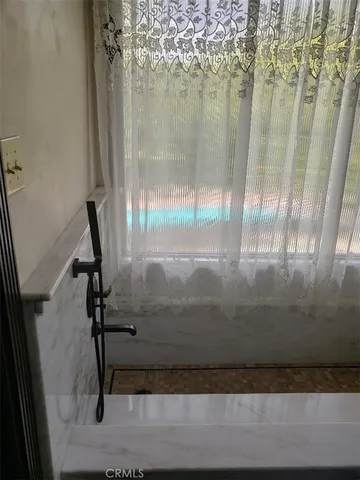 a bathroom with a sink a vanity and a mirror