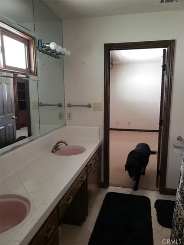 a kitchen with stainless steel appliances kitchen island granite countertop a refrigerator and a sink